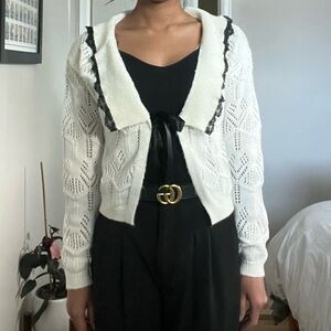Creamy white and black lace trimmed collared cardigan.